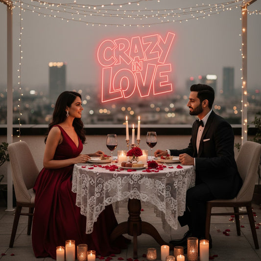 Lux Neon "Crazy in Love" neon sign in coral pink, mounted on a textured wall above a bed.