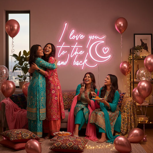 Lux Neon "I love you to the moon and back" pink neon sign with a crescent moon and heart detail above a bed.