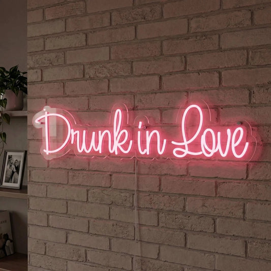 Drunk in love neon sign in a cafe
