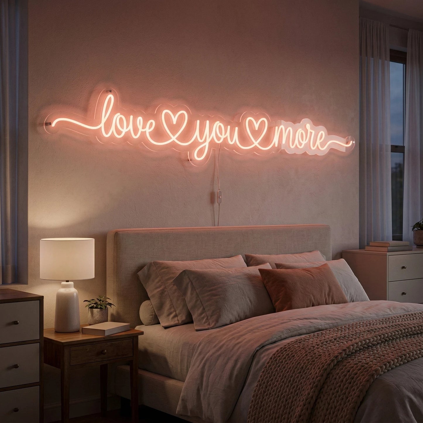 Neon sign 'love you more' above a bed in a bedroom.