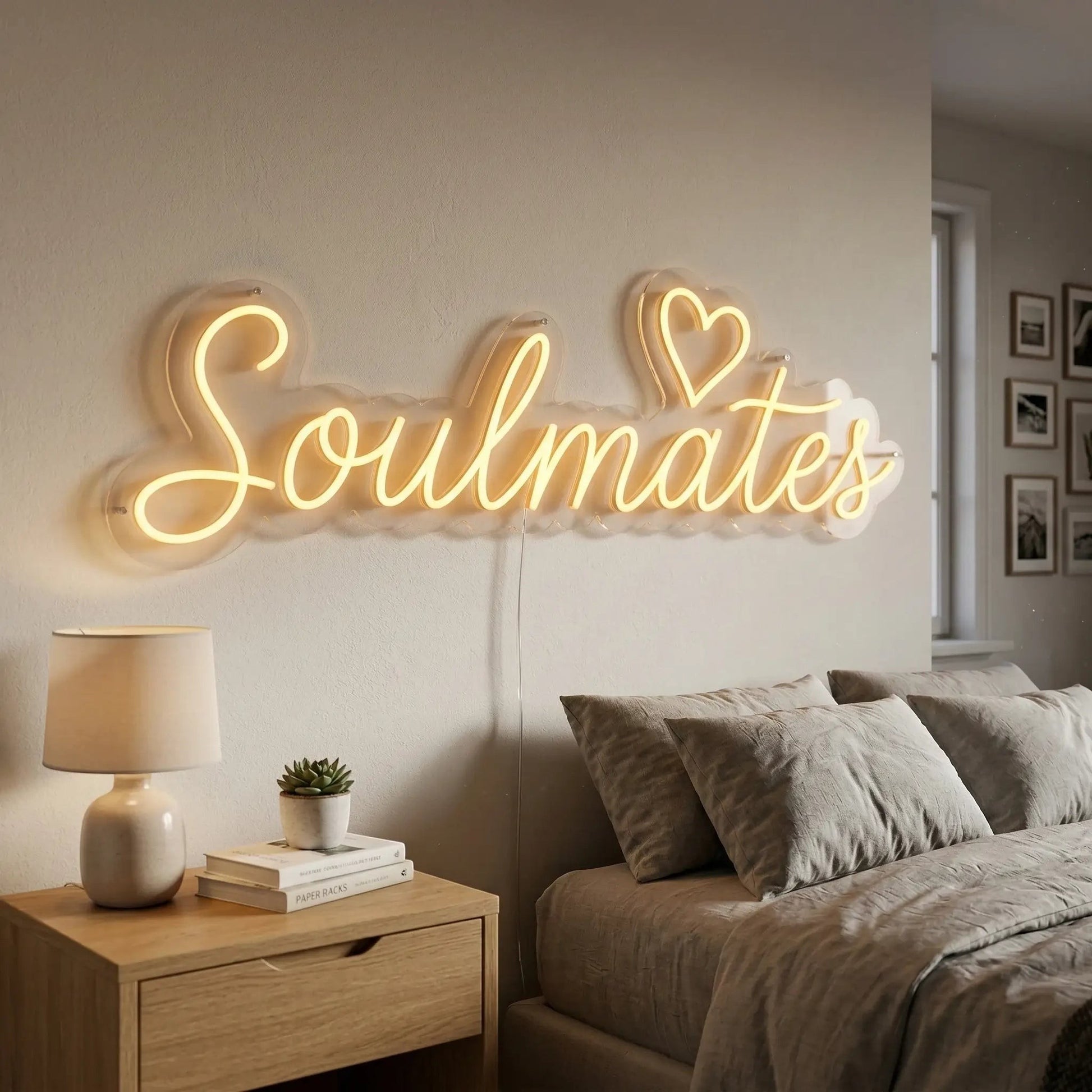 Neon sign with 'Soulmates' in a bedroom setting