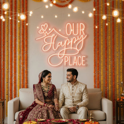 Lux Neon "Our Happy Place" neon sign in peach glow, featuring script font and heart detail above a bed.